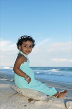 Little Maldivian girl on beach