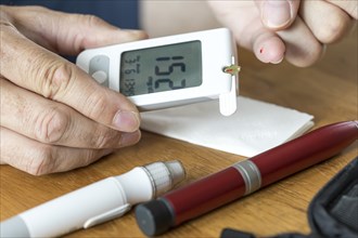 Diabetics measuring blood glucose