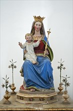 Virgin Mary holding baby Jesus with scepter and crown at the monastery Church of St. Peter and Paul in Weyarn