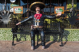 Mexican figure on a bank