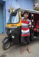 Boy with autorickshaw