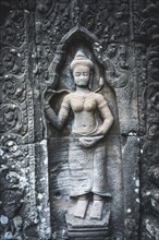 Stone relief of a divine dancer