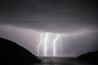 Thunderstorm with lightning over the ocean