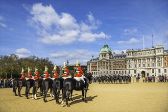 Royal Guards in red uniform on horses