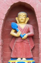 Statue decorating the base of the Bumisparsha mudra Buddha Statue