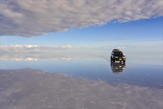 All terrain vehicle driving on a lake