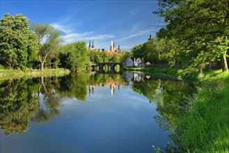 Merseburg Cathedral and Merseburg Castle are reflected in the River Saale