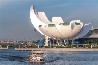 ArtScience Museum on Singapore River with boat