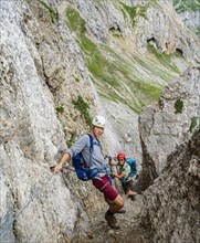 Hikers on via ferrata