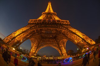 Illuminated Eiffel Tower at dusk
