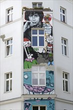 Graffiti on a renovated house