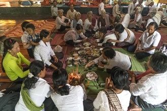 Locals eating together in the temple of Phnom Sasear
