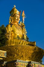 Big golden statue of Padmasambhava at back of Swayambhunath temple