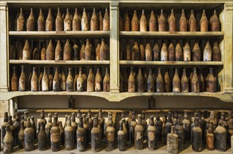 Showroom with old dust covered sherry bottles