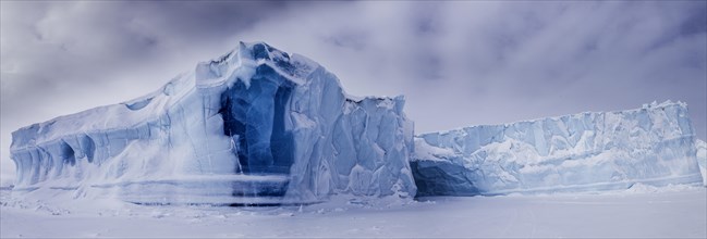 Panoramic view of icebergs seen from frozen fjord