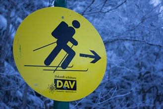 Yellow information sign for ski tourers