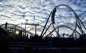 Silhouette of roller coaster in backlight