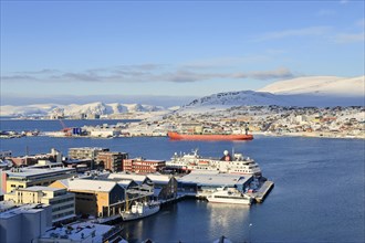 Wide bay with city and Hurtigruten dock
