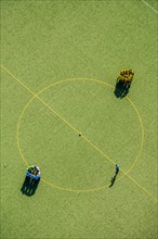 Football players at the center circle