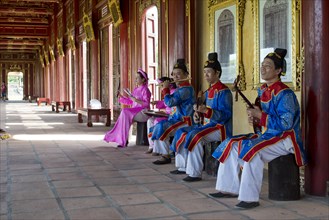 Vietnamese musicians in traditional robes of the court