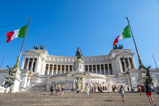 Italian flags drifting in front of Monumento Nazionale a Vittorio Emanuele II