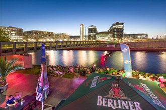 Beach bar Capital Beach at dusk at the river Spree opposite central railway station