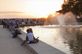 People enjoying the sunset at Debod Temple