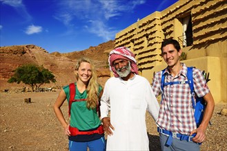 Bedouin with Tourists in front of Feynan Ecolodge
