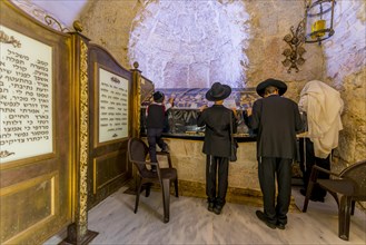 Praying Orthodox Jews in front of the tomb of David