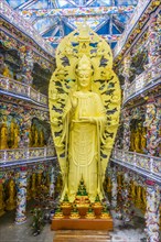 Giant golden standing Buddha