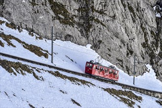 Rack railway going up Mount Pilatus in winter