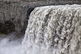 Person at the waterfall Dettifoss
