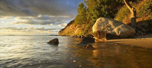 Coastline with large boulders on the beach