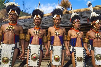 Naga tribal men in traditional clothing performing ritual dances