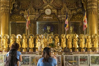 Praying Buddhists in the Sule Pagoda