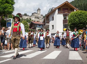Traditional procession behind Taufers Castle
