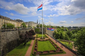 Luxembourg national flag in the park at the Place de la Constitution