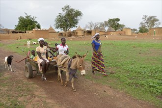Family with donkey cart