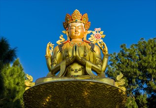 Big golden statue of Maitreya Buddha at back of Swayambhunath temple