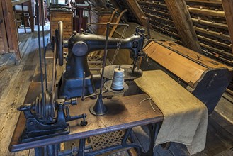 Old bag sewing machine for flour sacks in the attic of a mill
