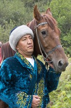 Kazakh man with his horse