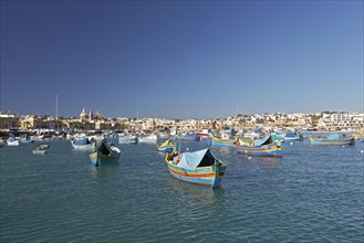 Cityscape with colorful fishing boats