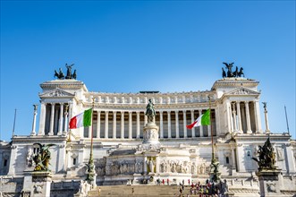 Italian flags drifting in front of Monumento Nazionale a Vittorio Emanuele II
