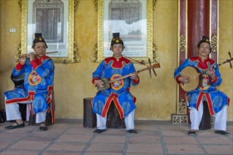 Vietnamese musicians in traditional robes of the court