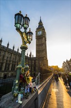 Big Ben and flowers commemorating terrorist attack on Westminster Bridge