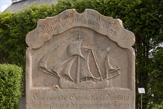 Old grave stone with Sailboat on cemetery