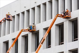 Workers on elevating platforms
