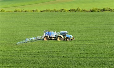 Tractor with field sprayer