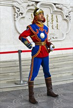 Guardian of the Mongolian armed forces in traditional uniforms in front of the Dschingis-Khan monument at the parliament building