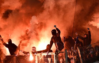 Masked football fans rampage